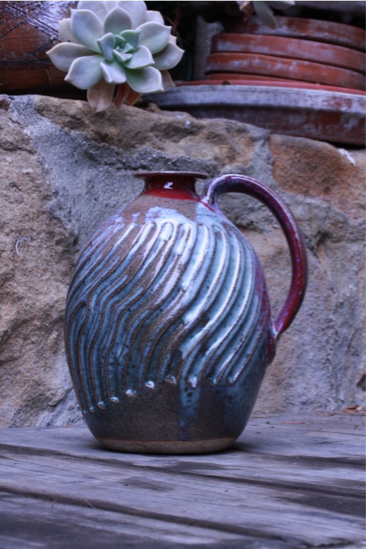 stoneware jug red and turquoise